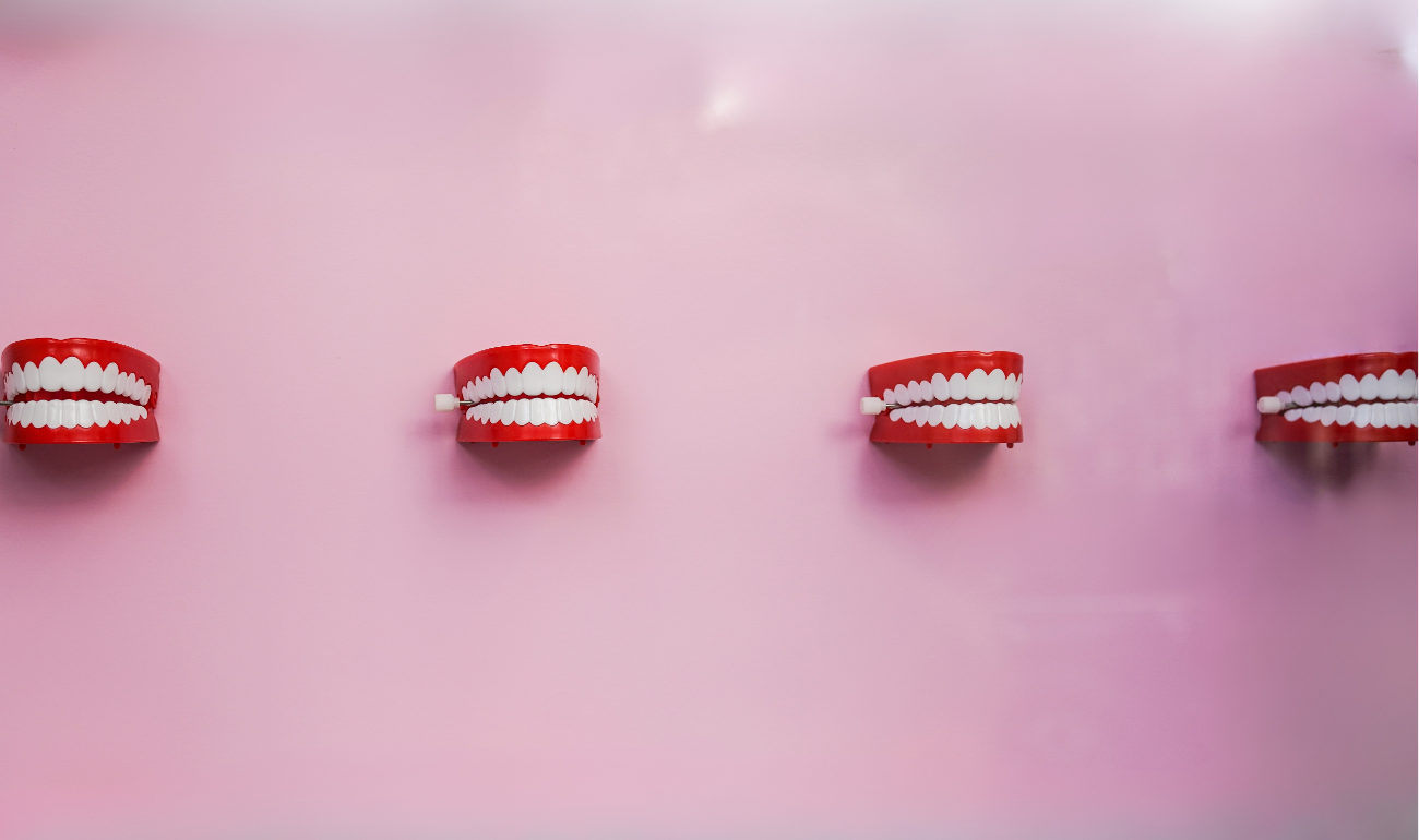 Mechanical teeth, mounted onto a pink wall