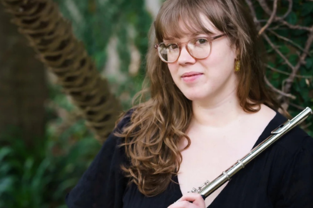 Emma Claire holding a flute 